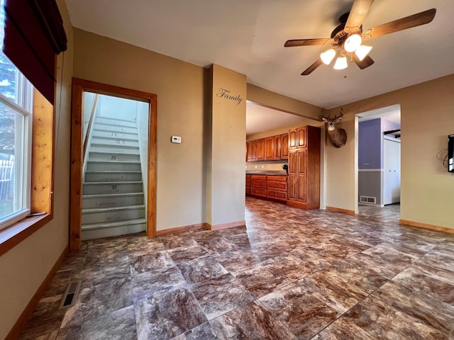 unfurnished room featuring ceiling fan