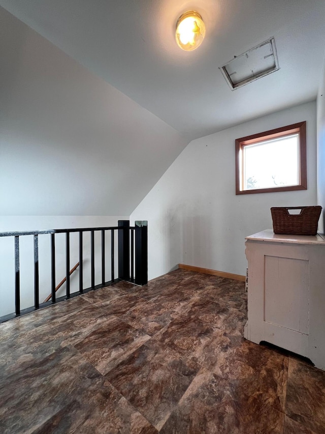 bonus room featuring vaulted ceiling