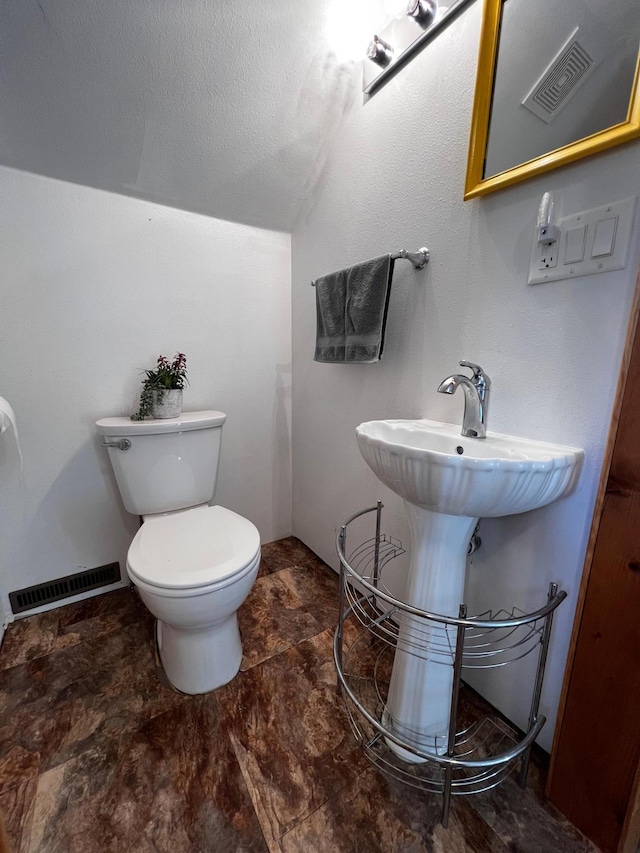 bathroom featuring toilet