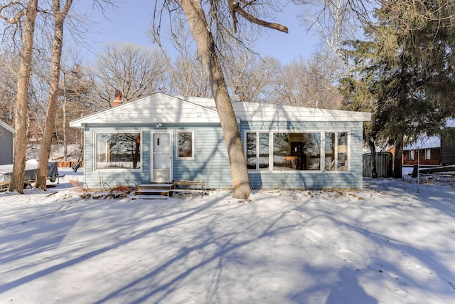 view of snow covered house