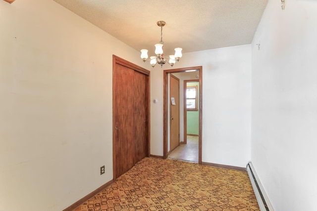 interior space featuring a chandelier and a baseboard radiator