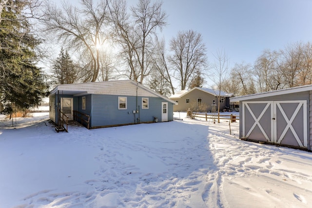 view of snow covered house