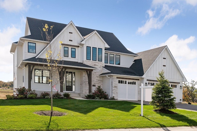 modern farmhouse style home with a front yard and a garage