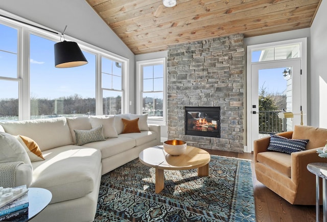 living room featuring dark wood-style floors, lofted ceiling, wooden ceiling, and a fireplace