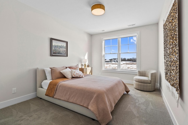 carpeted bedroom featuring baseboards and visible vents