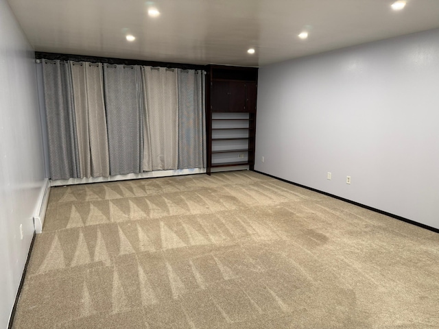 unfurnished room with light carpet