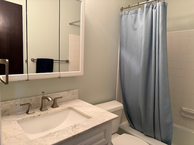 full bathroom featuring vanity, toilet, and shower / tub combo