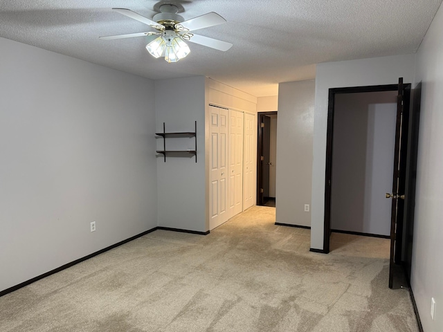 2007 122nd St Unit B2, Burnsville, MN 55337 - unfurnished bedroom featuring carpet, a ceiling fan, baseboards, and a textured ceiling