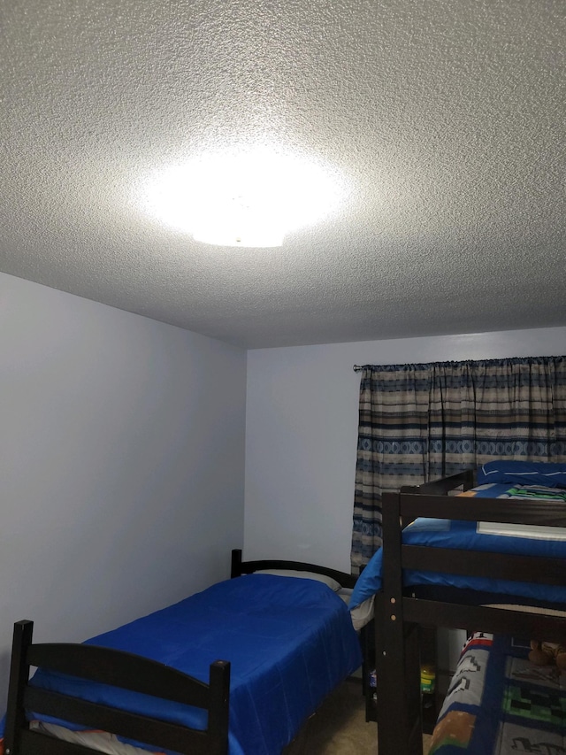 bedroom featuring a textured ceiling