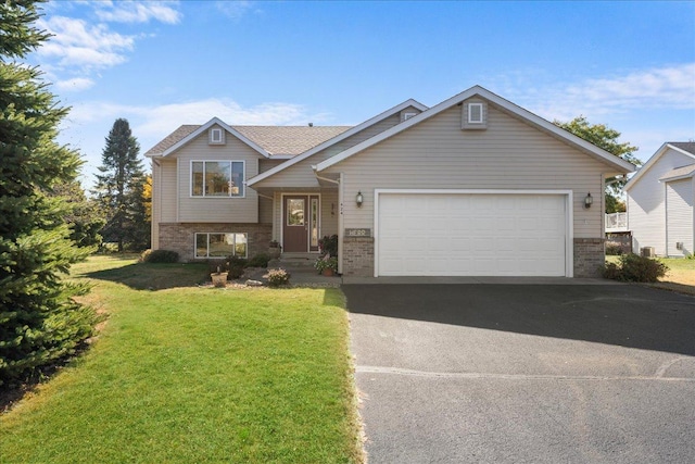 view of front of home featuring a front lawn and a garage