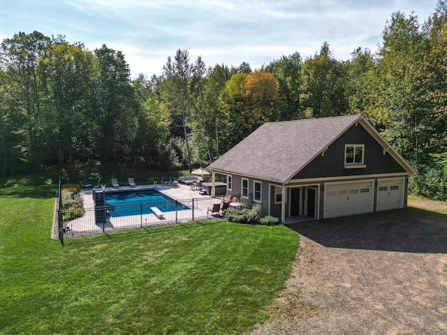 view of swimming pool featuring a yard and a patio