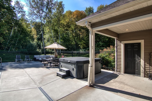 view of patio / terrace with a hot tub