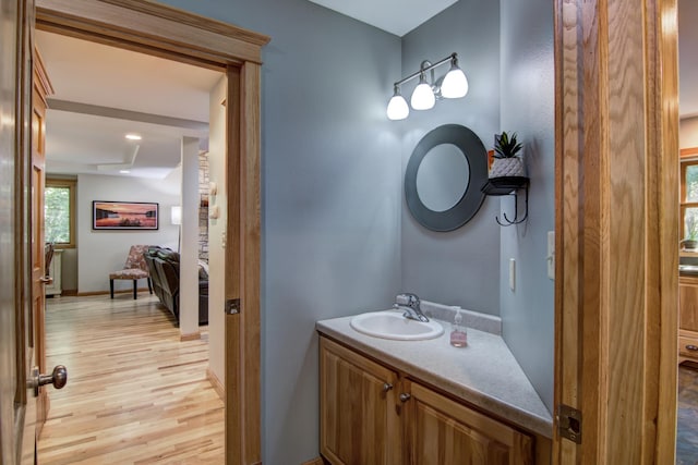 bathroom with vanity and hardwood / wood-style floors