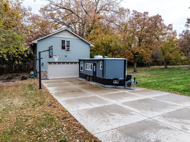 exterior space featuring a garage and a lawn