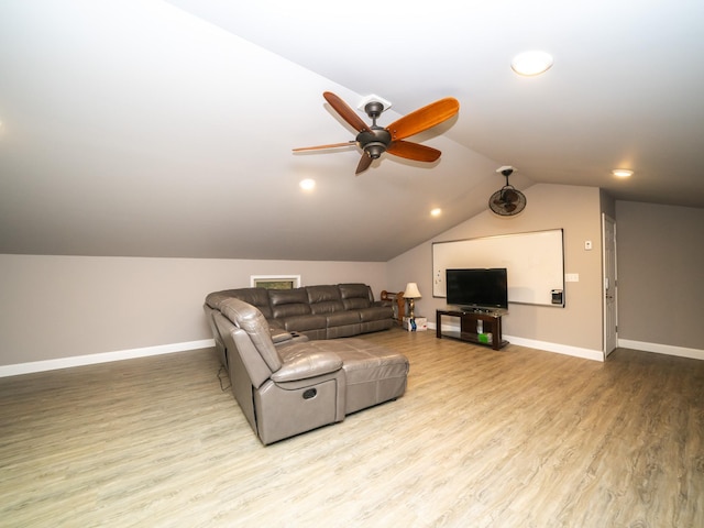 living room with vaulted ceiling, light hardwood / wood-style floors, and ceiling fan