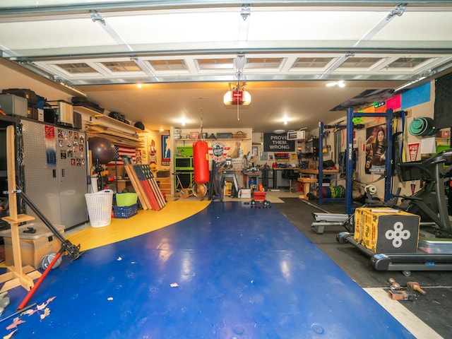 garage with stainless steel refrigerator