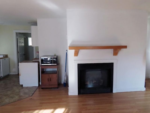 unfurnished living room with light wood-type flooring