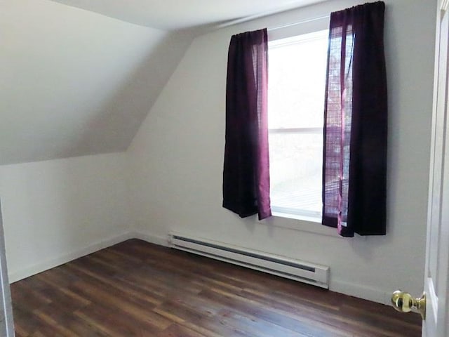 bonus room featuring lofted ceiling, dark hardwood / wood-style floors, baseboard heating, and a wealth of natural light