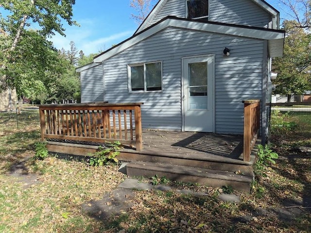 rear view of house featuring a deck