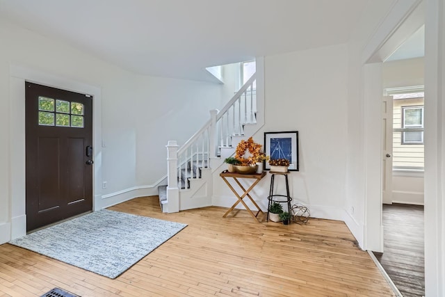 foyer featuring a healthy amount of sunlight and light hardwood / wood-style flooring