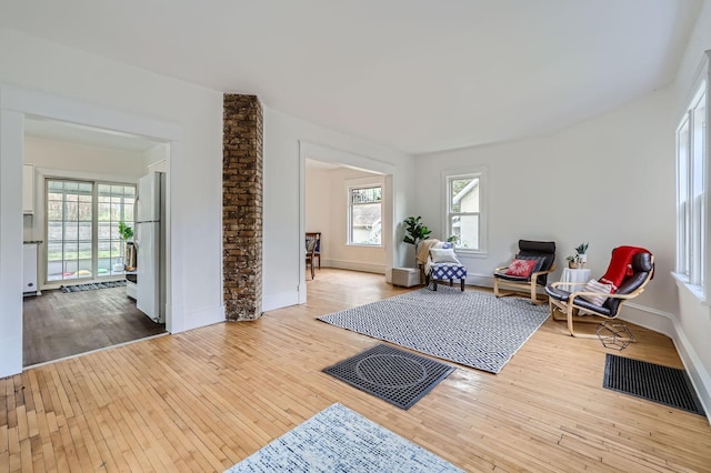 sitting room with hardwood / wood-style flooring