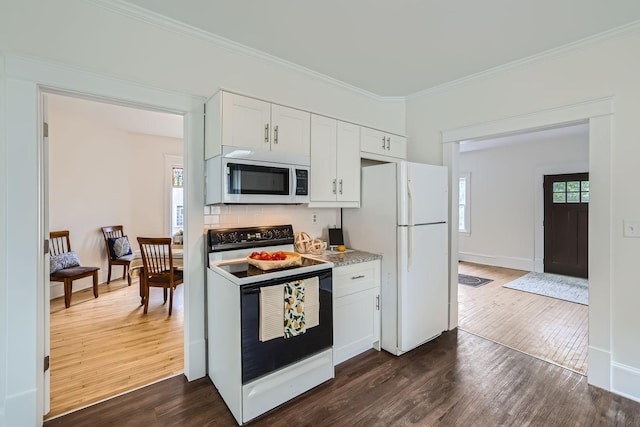 kitchen with white cabinets, ornamental molding, dark hardwood / wood-style flooring, and white appliances