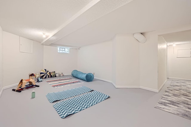 bedroom featuring a textured ceiling and concrete floors