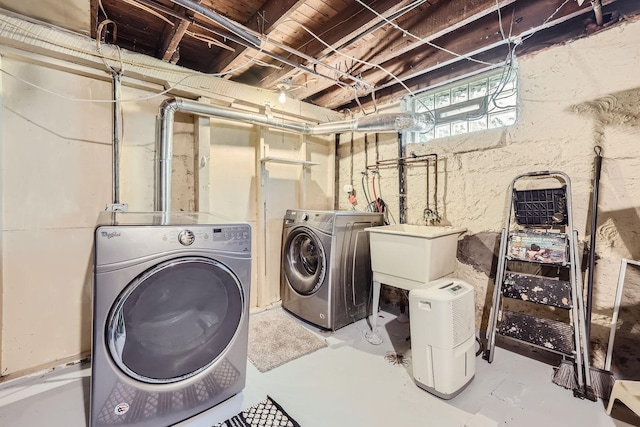 laundry area featuring sink and washer and dryer