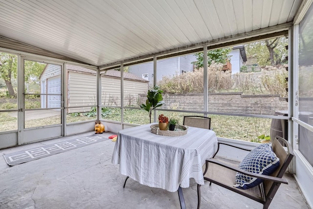 sunroom featuring lofted ceiling