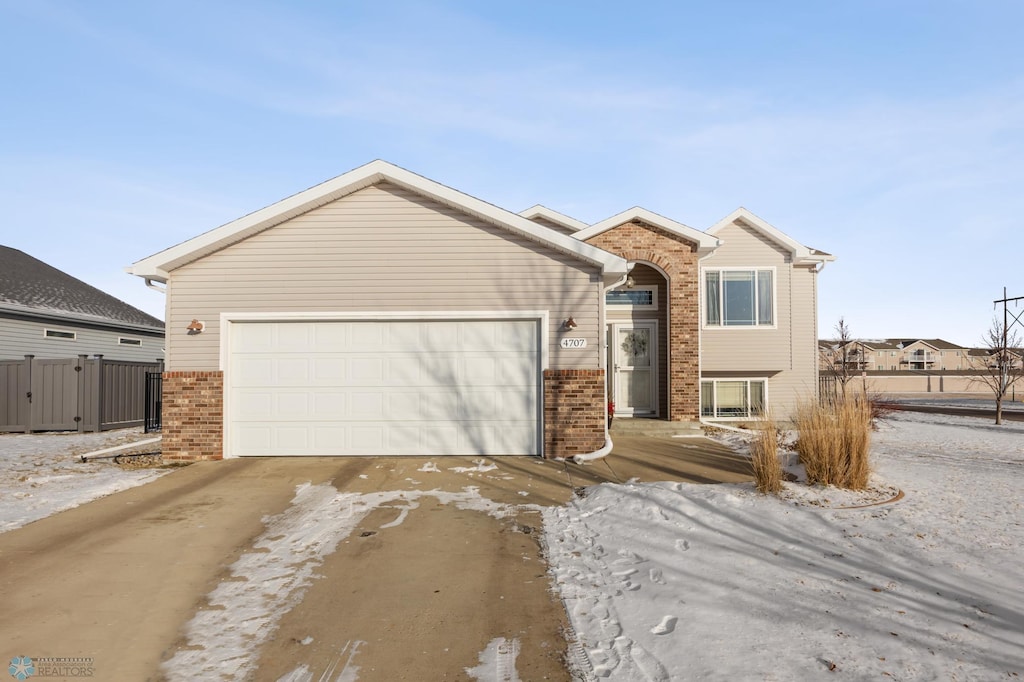 view of front of property featuring a garage