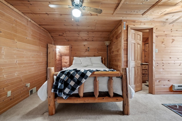 carpeted bedroom with wooden ceiling, ceiling fan, wood walls, and lofted ceiling