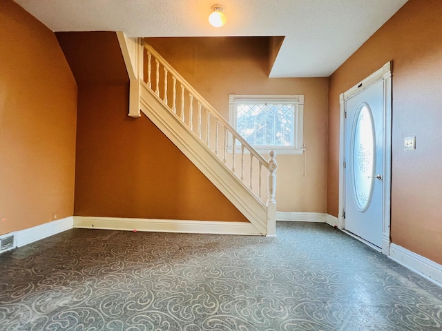 entrance foyer with a textured ceiling