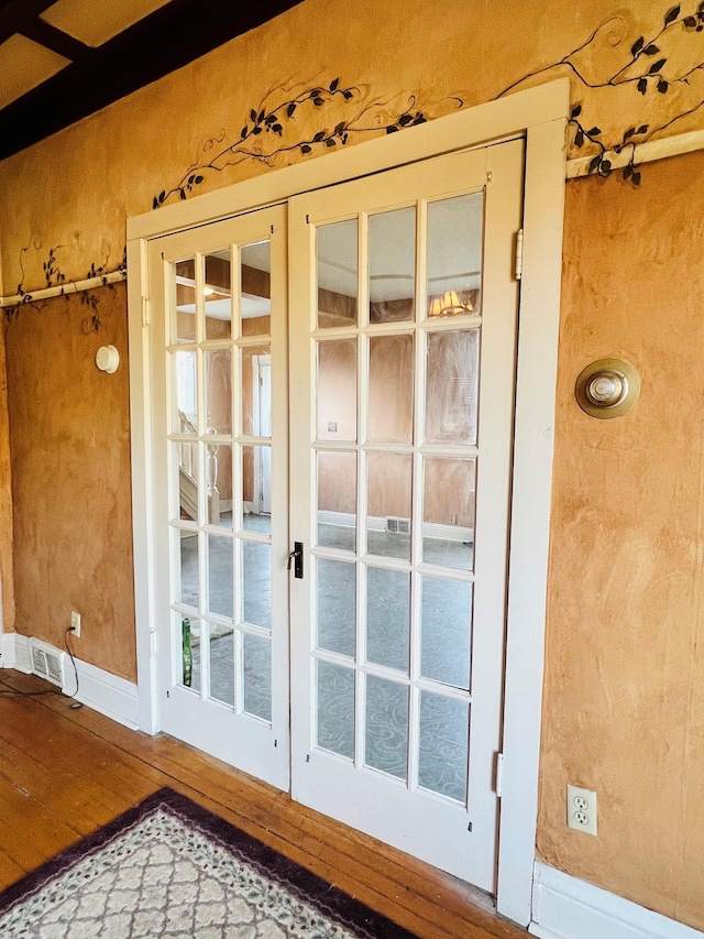 doorway to outside with hardwood / wood-style floors