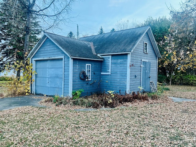 exterior space featuring an outdoor structure and a garage