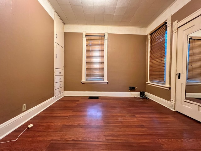 empty room featuring dark hardwood / wood-style floors