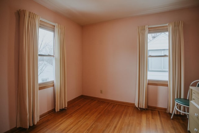 unfurnished room featuring hardwood / wood-style floors