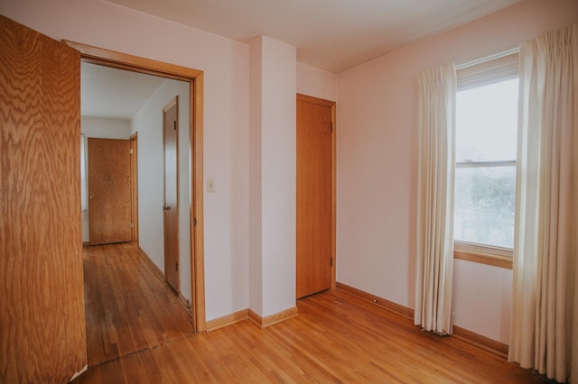 corridor featuring light hardwood / wood-style floors