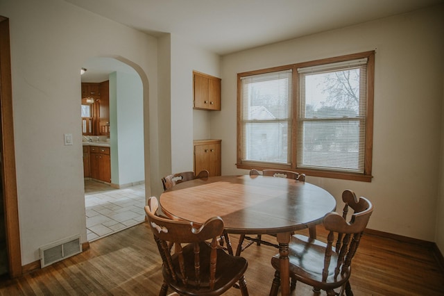 dining area with wood-type flooring