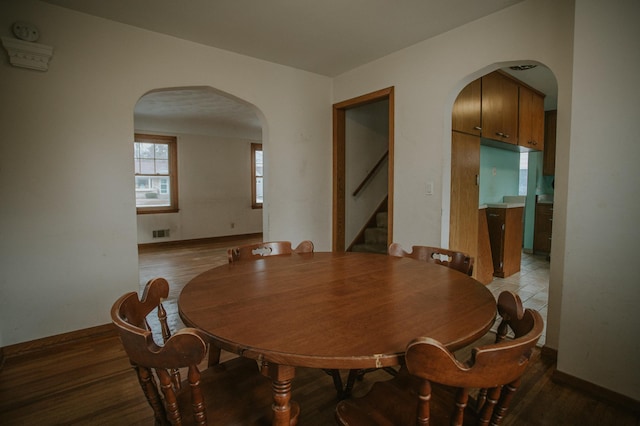 dining area with wood-type flooring