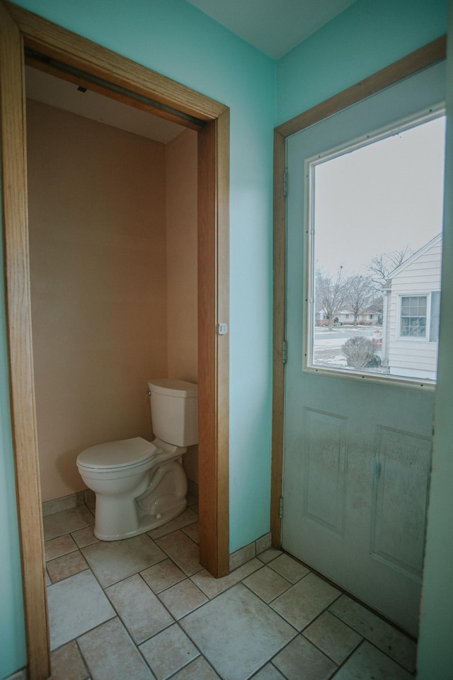 bathroom featuring tile patterned floors and toilet