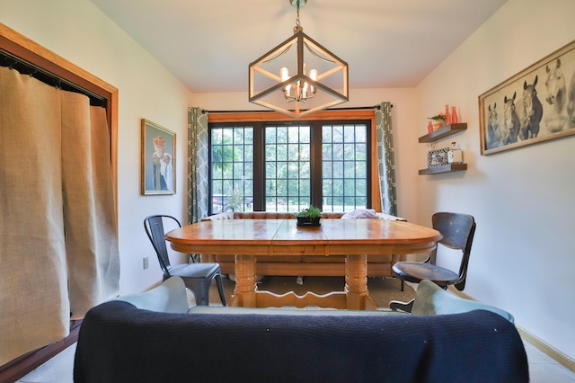 dining space with a notable chandelier
