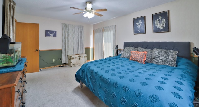 bedroom featuring ceiling fan and carpet flooring