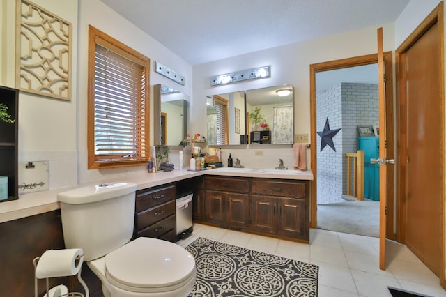bathroom featuring tile patterned flooring and vanity