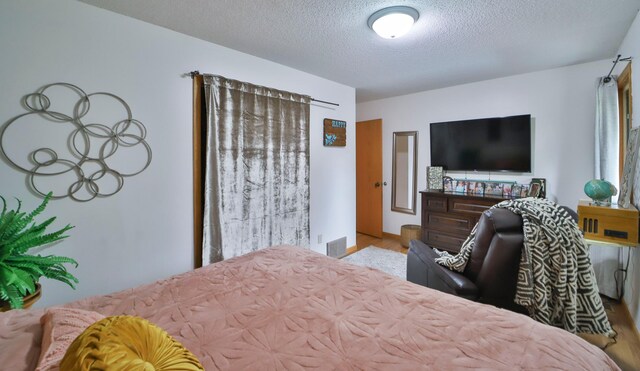 bedroom featuring a textured ceiling