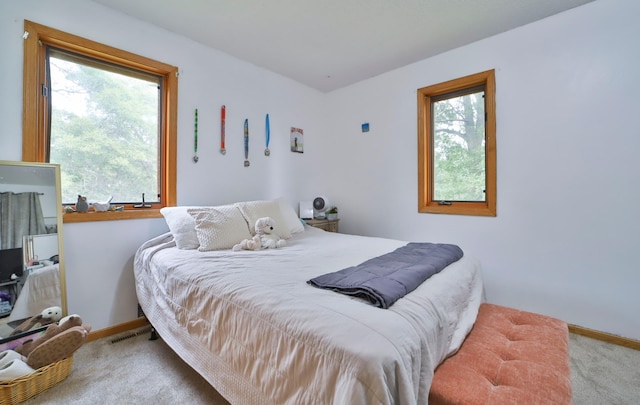 carpeted bedroom with baseboards