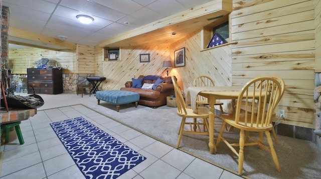 interior space with wooden walls and tile patterned flooring
