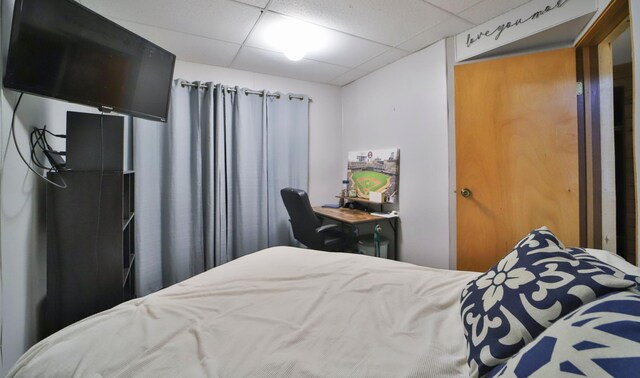 bedroom with a paneled ceiling