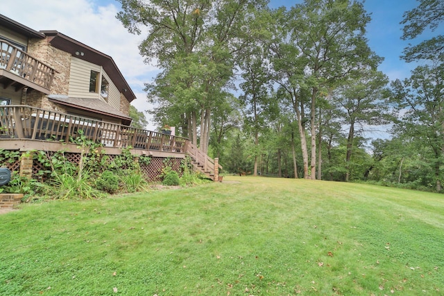 view of yard with a wooden deck