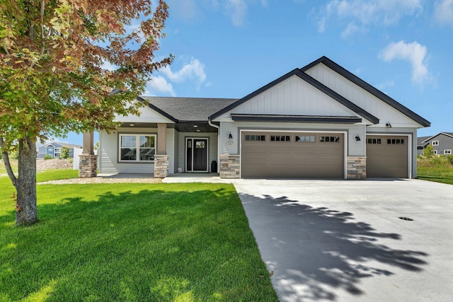 craftsman inspired home featuring a front yard, a porch, and a garage