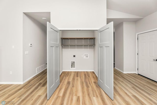 laundry room featuring light hardwood / wood-style flooring, washer hookup, and electric dryer hookup